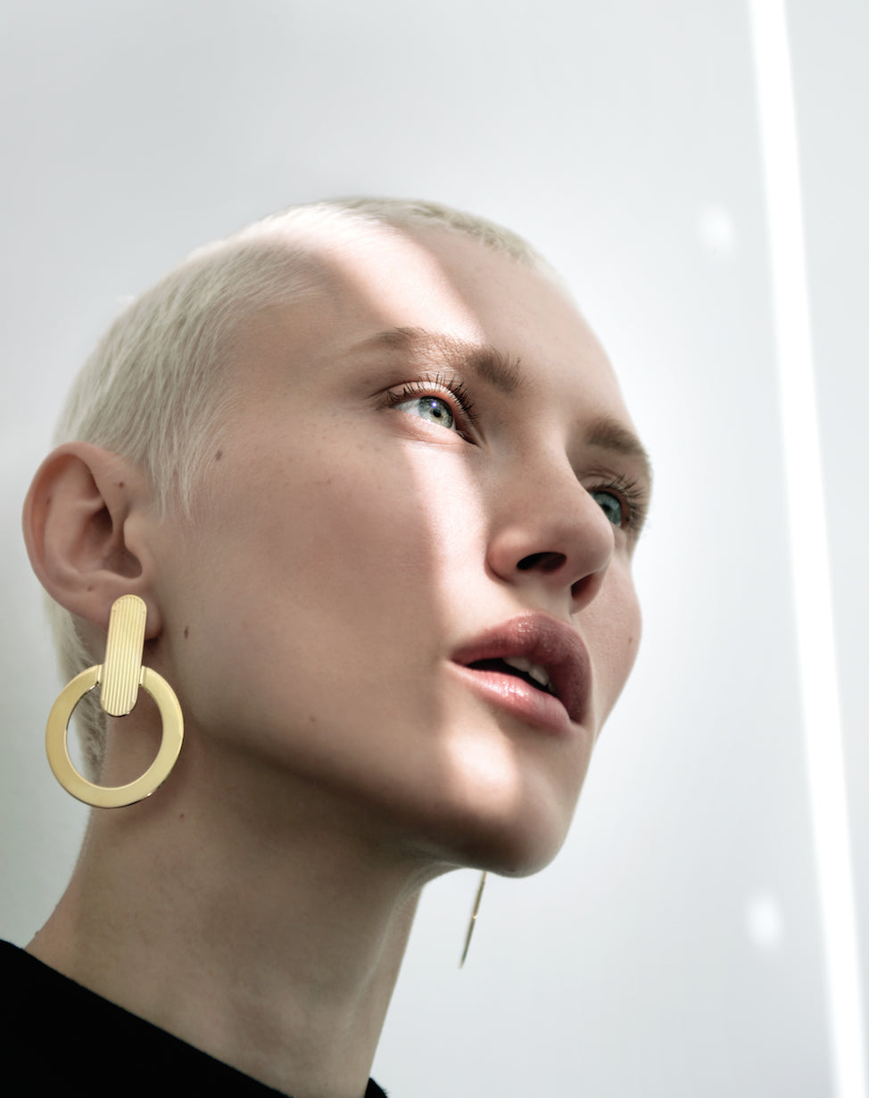 Boucles d'oreilles dorées - Trouble